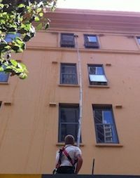 Long Extension Pole in action cleaning windows