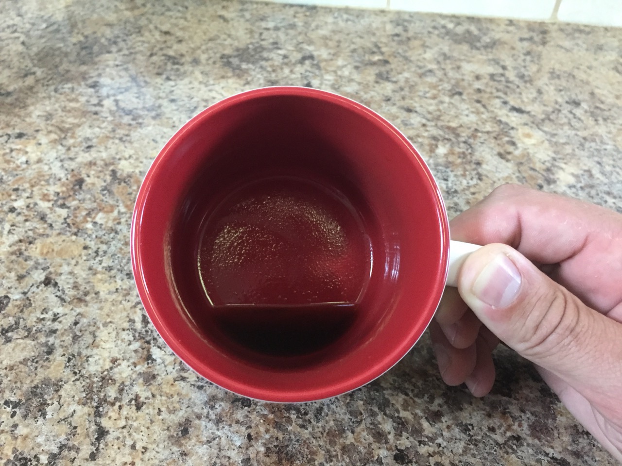 Sediment at bottom of a cup of french press coffee