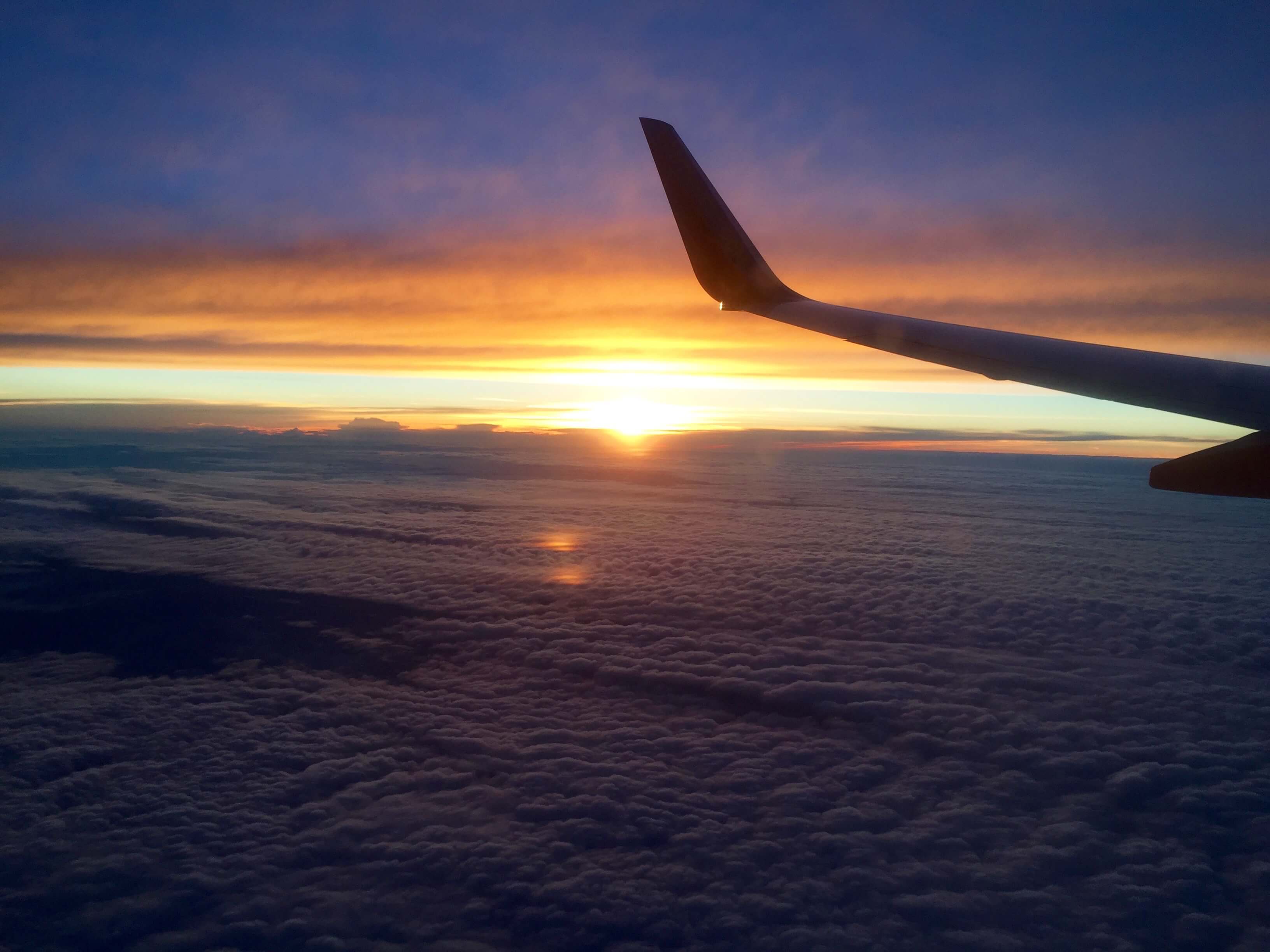 blog-top-5-adventures-before-25-sunset-on-a-plane