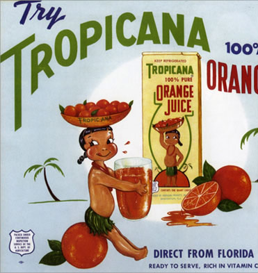 Tropic Ana, a girl wearing a grass skirt and a lei sitting on an orange.