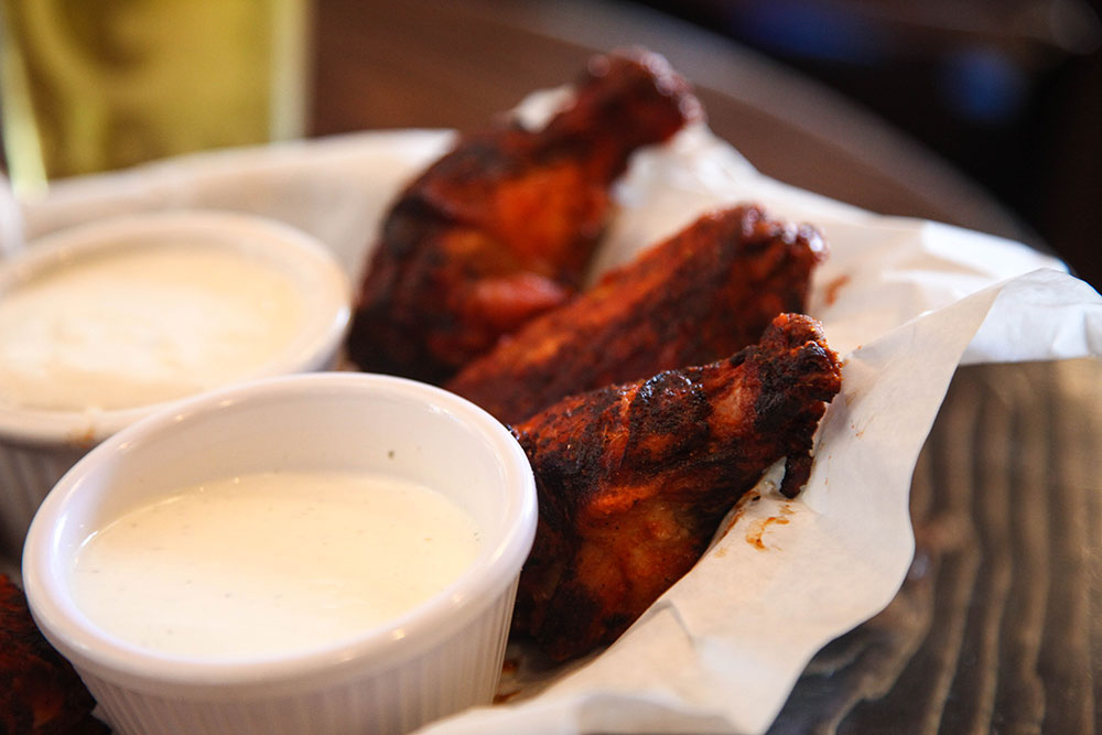 Albert G's smoked chicken wings, with what they call Roughneck sauce, really have a flavorful taste and a little kick to them. (Photo: Marc Rains)