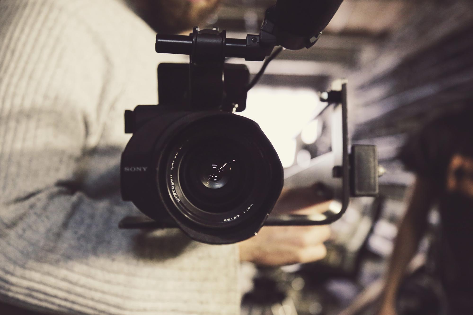 Videographer holding camera