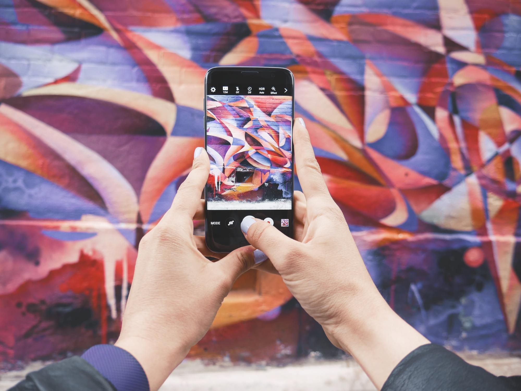 Taking a photo of graffiti