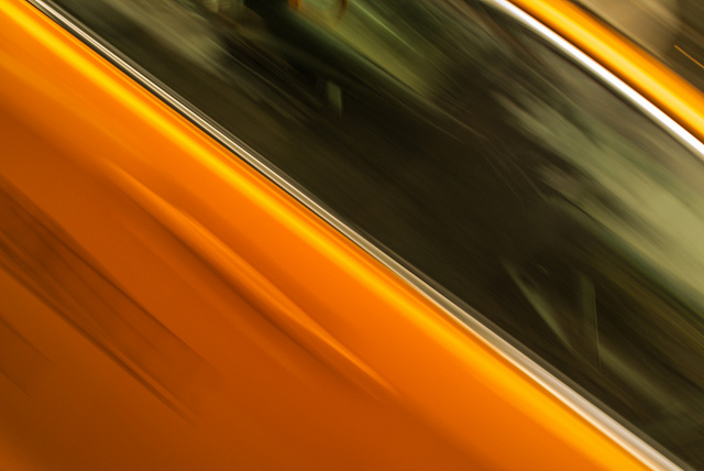 Yellow taxi driving by