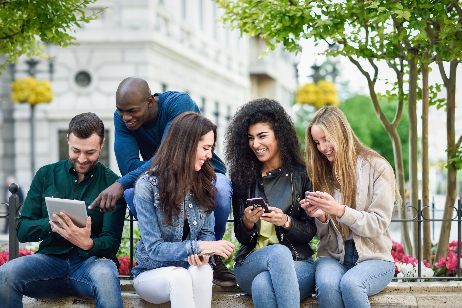 People Using Smartphones And Tablets
