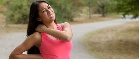 young woman experiencing severe neck pain