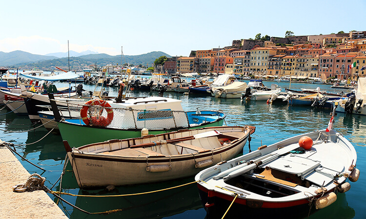 Colourful boats tied up in bay