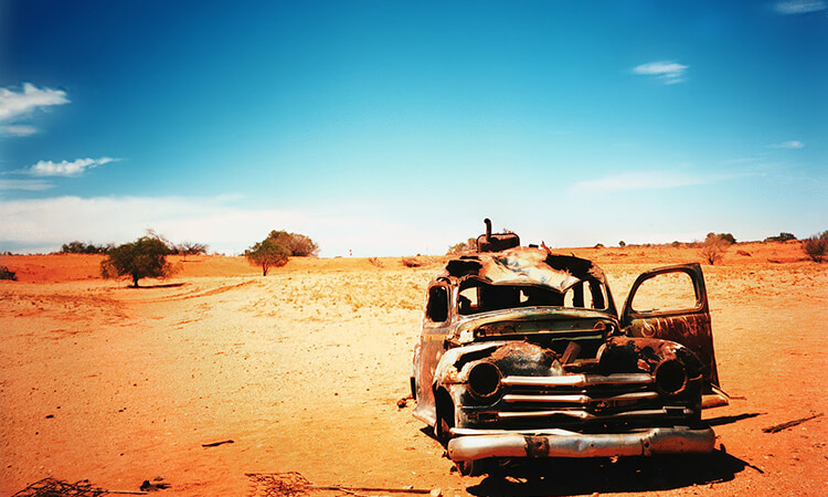 Old rusted car in the desert