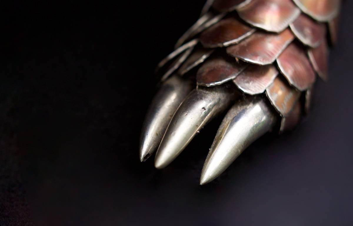 Detailed close up of claws of metal pangolin sculpture