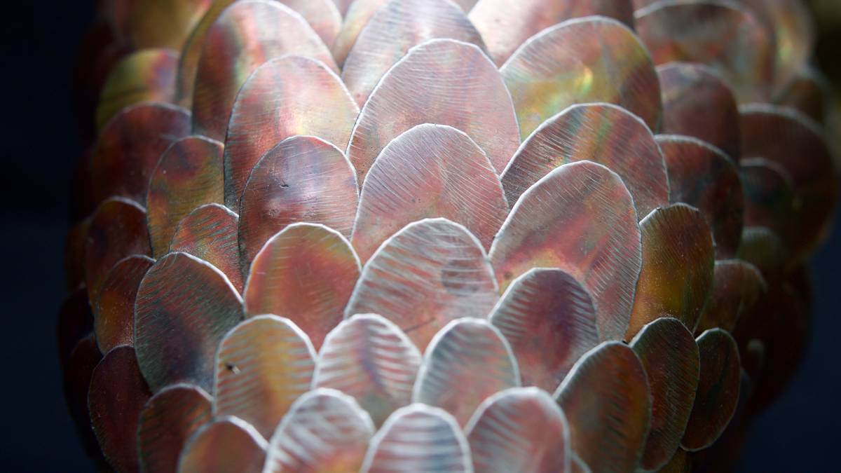 Detailed scale close up from metal pangolin sculpture.